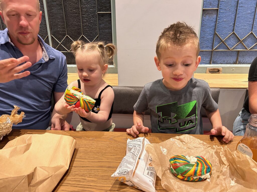 Kids eating rainbow bagel