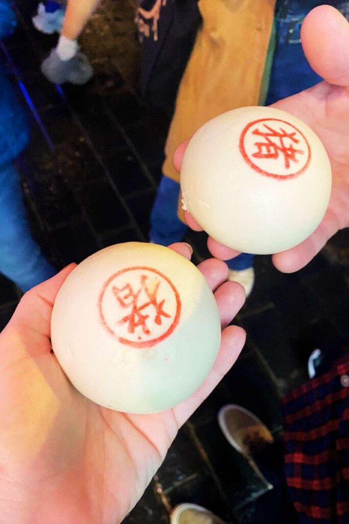 2 buns with chinese writing.