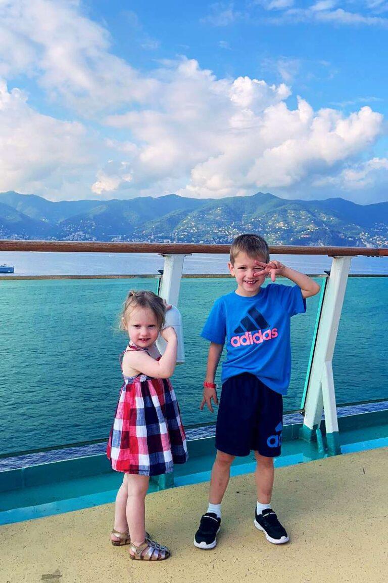 Two kids standing on a cruise ship.  Best kid friendly mediterranean cruises 