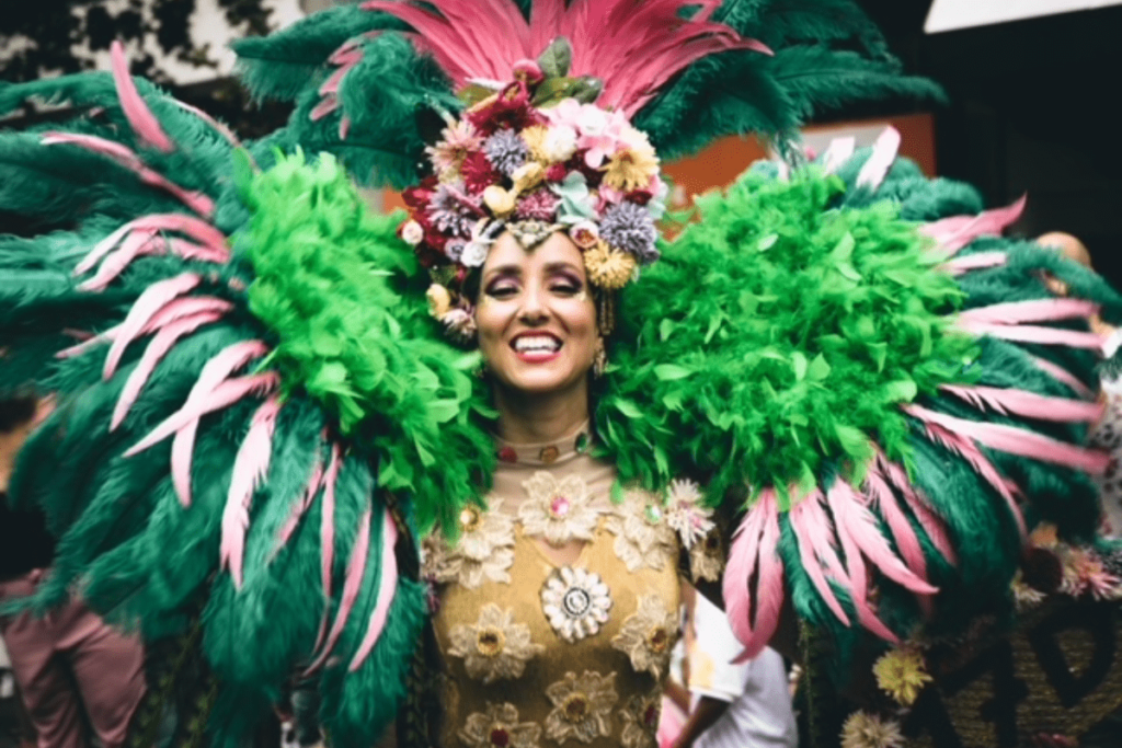 Women dressed up for carnival with feathers and flowers
