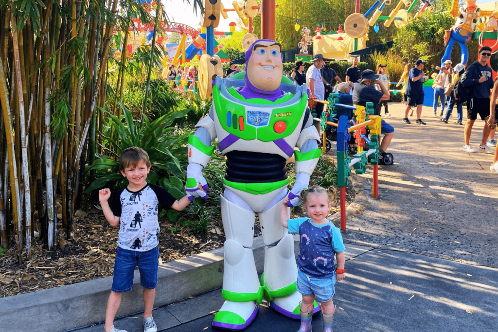 Two kids with Buzz lightyear character