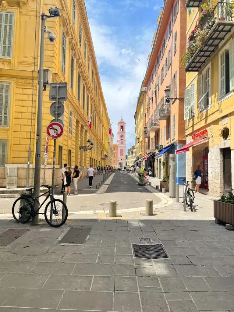 Narrow streets of Old Town Nice.  Nice vs Monaco