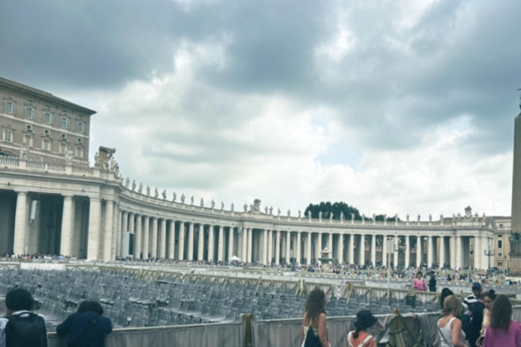 St Peters Square in Rome.  Large white building with large square in the front