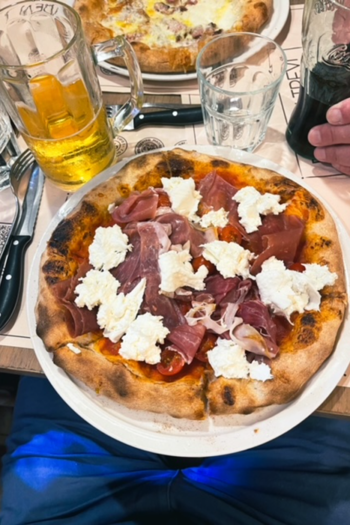 Pizza in Italy.  Cheese and meat 