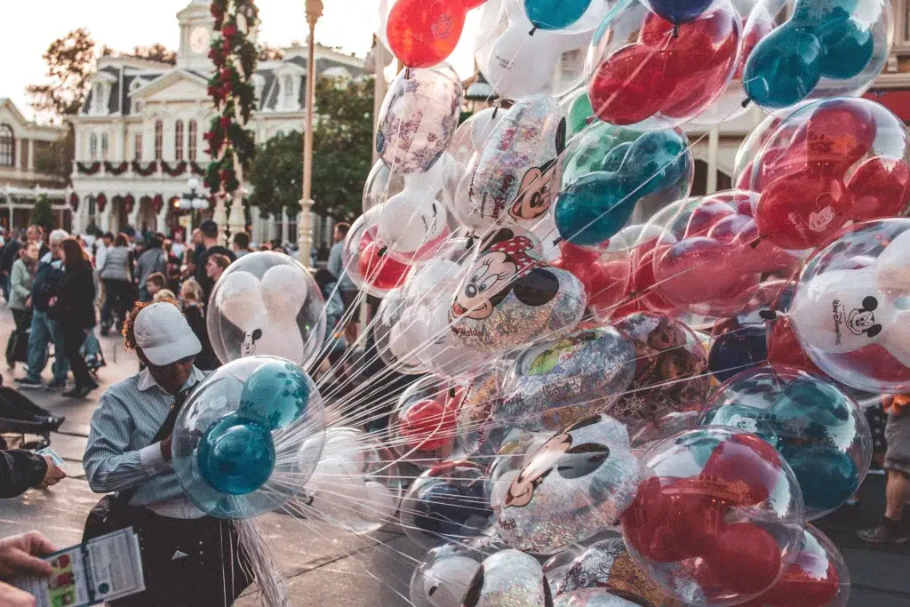 Balloons at Disney World.  Baloons are red, blue and white. 
