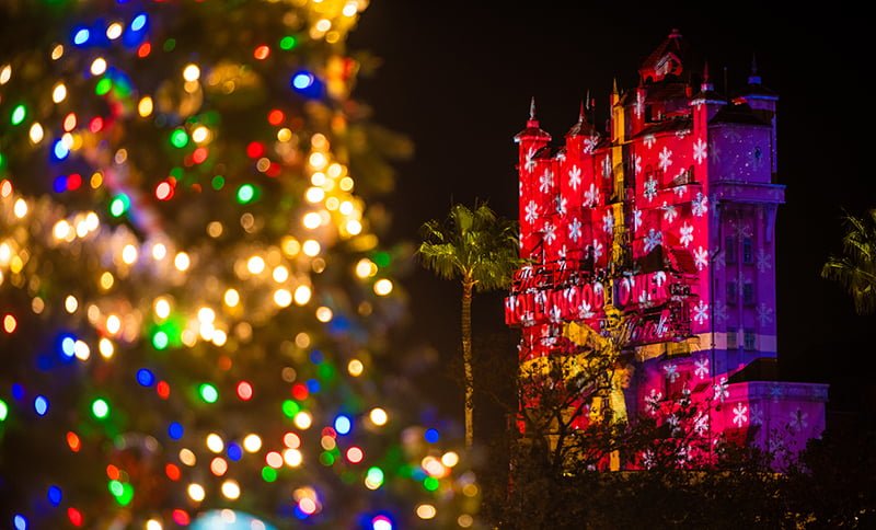 Projection of a christmas present onto hollywood studies tower of terror.  What to wear to Disney world in December