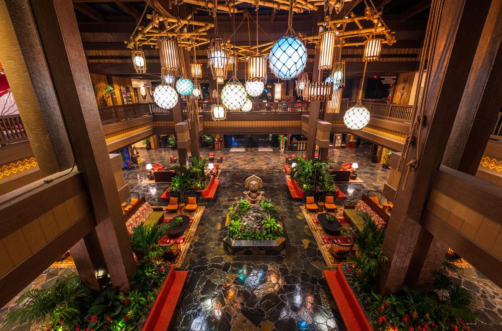 Polyneian themed hotel lobby with dark wood colors
