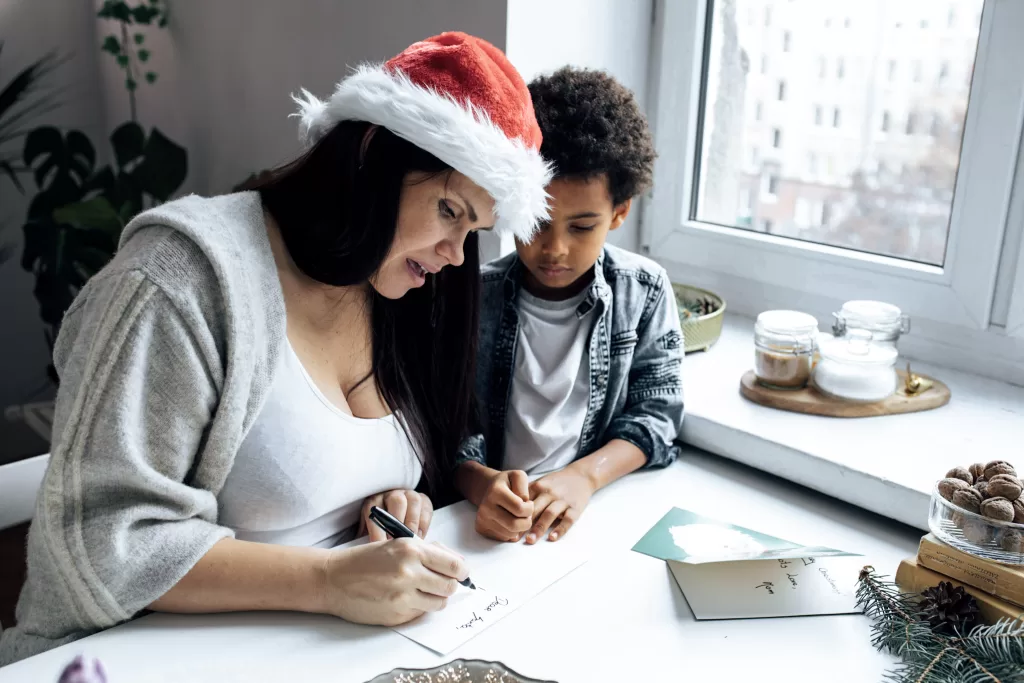 Mom and son writing a christmas list