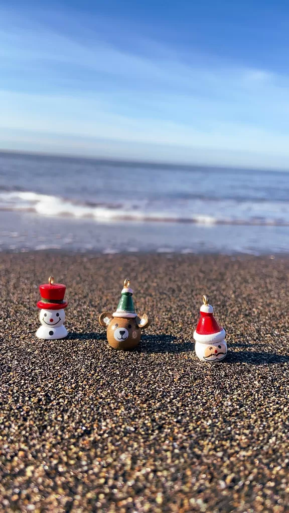 Three Christmas Ornaments on a Beach.  Christmas away from home