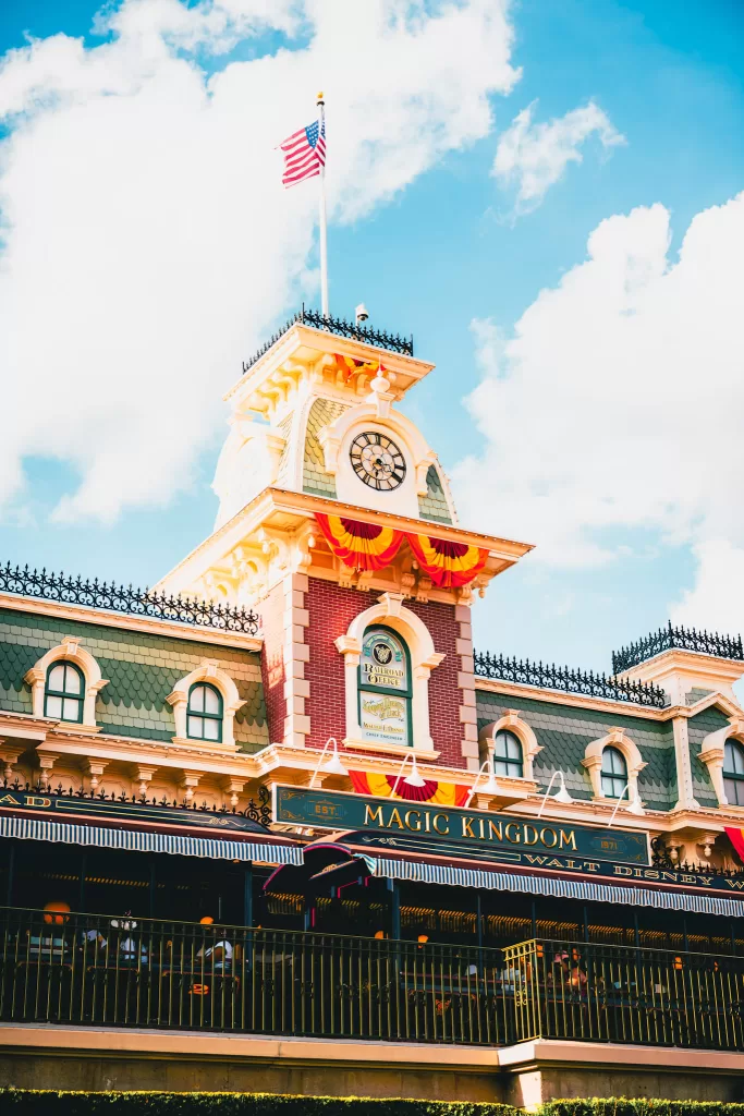 Is Mickey's Not So Scary Halloween Party Good for Kids? Picture is of the train station in magic kingdom decorated in fall colors of orange, yellow and red