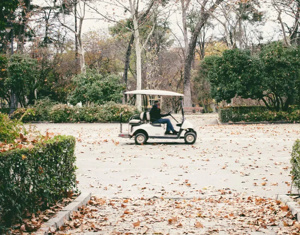 Golf cart in a parking lot.  Rome golf cart tours