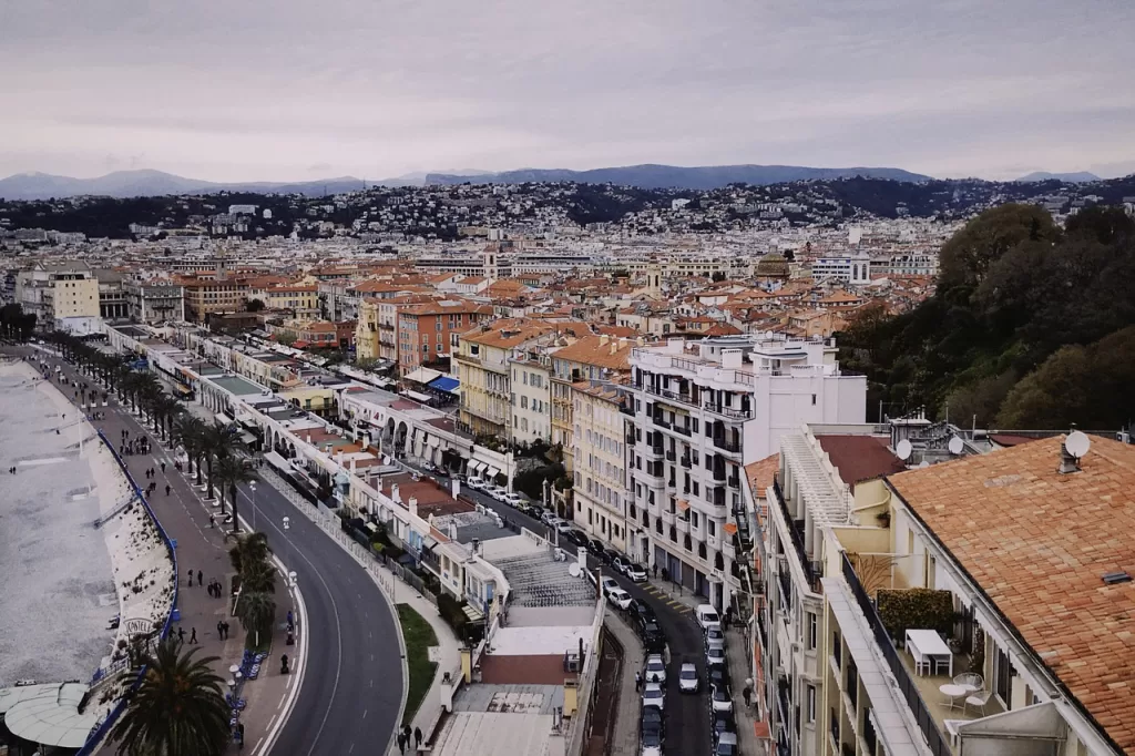 View of Nice france from a hill.  Overlookimg buildings, cars and the ocean.  Parking in Nice