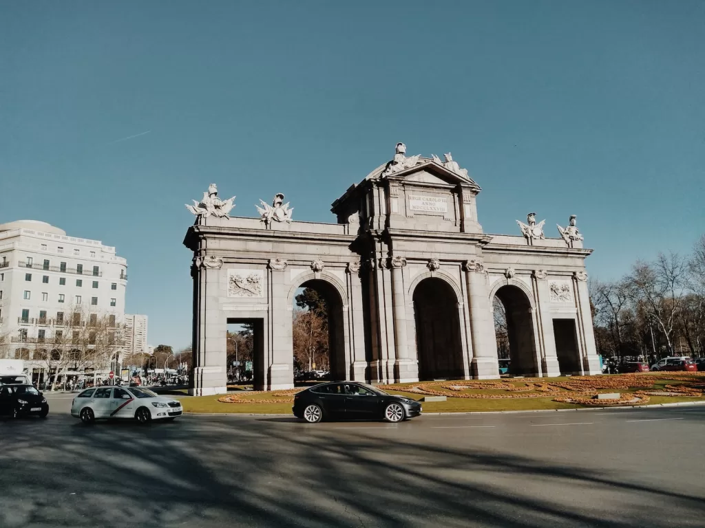 black car near white monument in Madrid