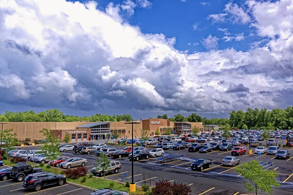 Walmart: brown building surrounded by parking lot