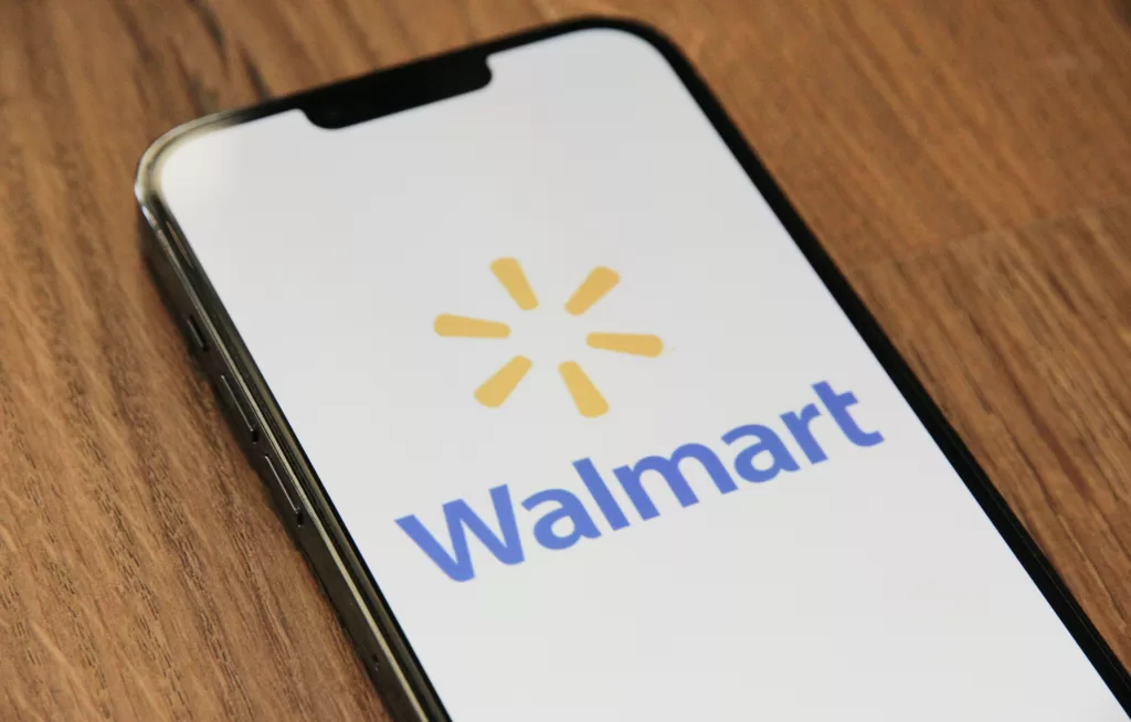 Walmart logo on phone screen. Closest Walmart to Disney World