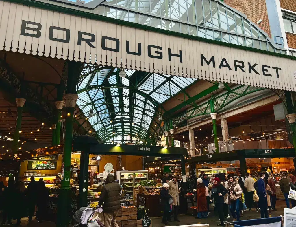 a group of people standing around a market