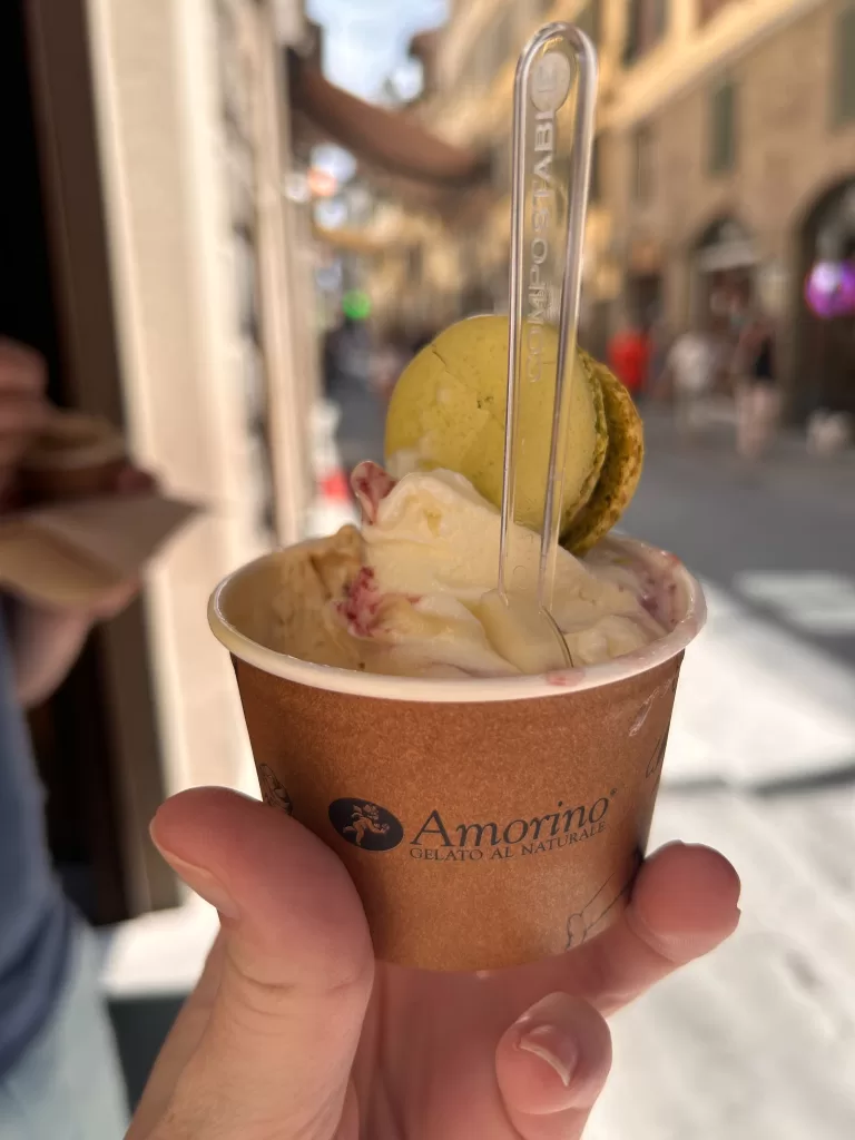 gelato in italy. Gelato is white in a brown cup.