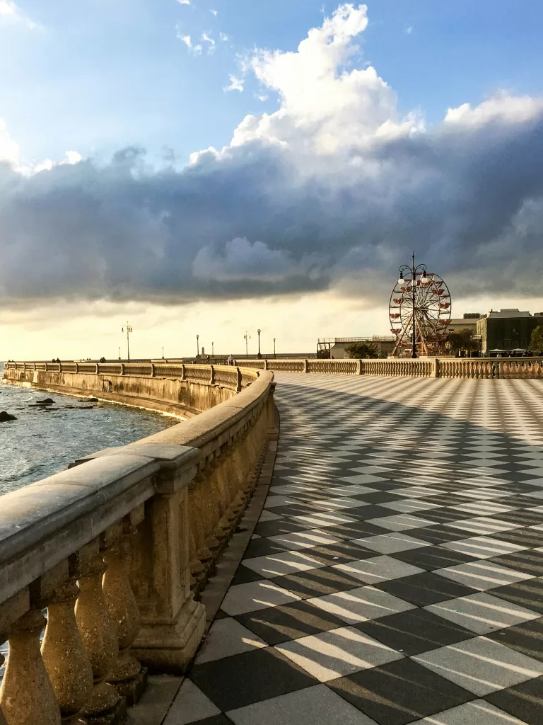 Black and white tiles on the ground along a promenade in Livorno italy. 