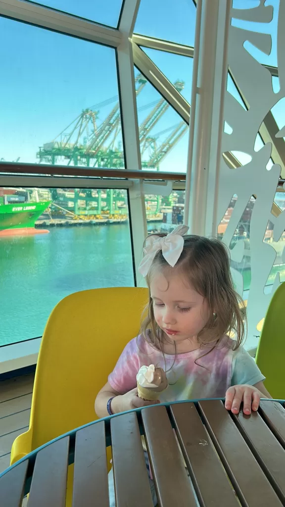 Small girl enjoying her ice cream cone on cruise ship.