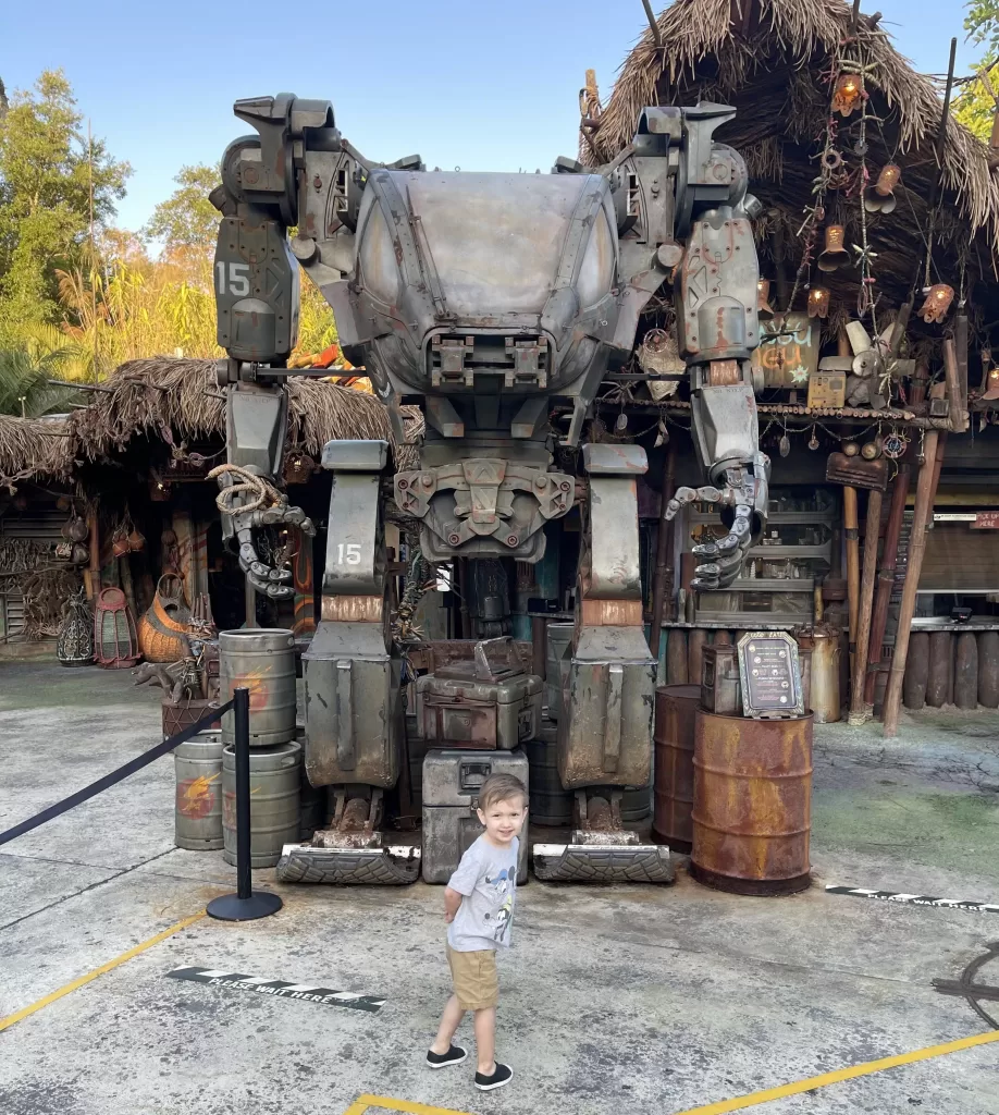Child in front of a robot in animal kingdom's land of avatar.
