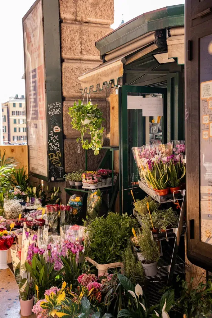 a store front with flowers