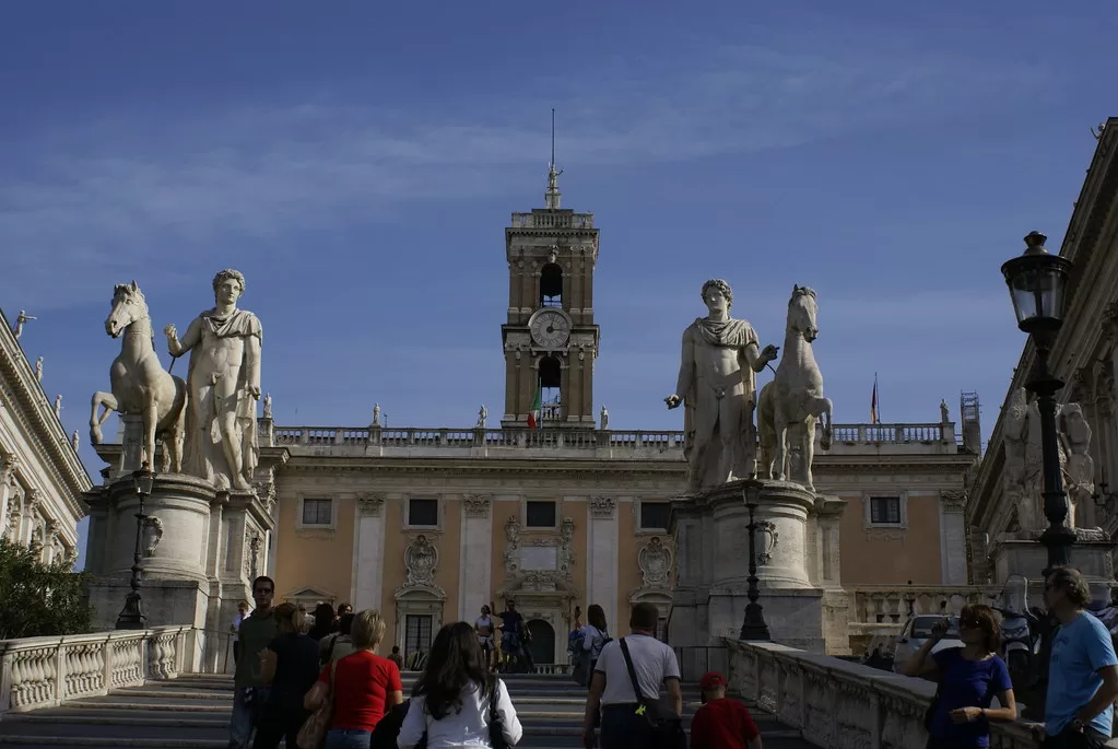 Large building with stairs leading up to is.  Statues flank the sides at Piazza del Campidoglio.  6 hours in Rome