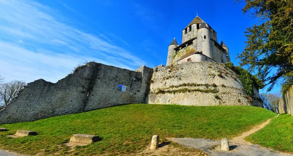 large stone wall and castle in the medieval city of provins france