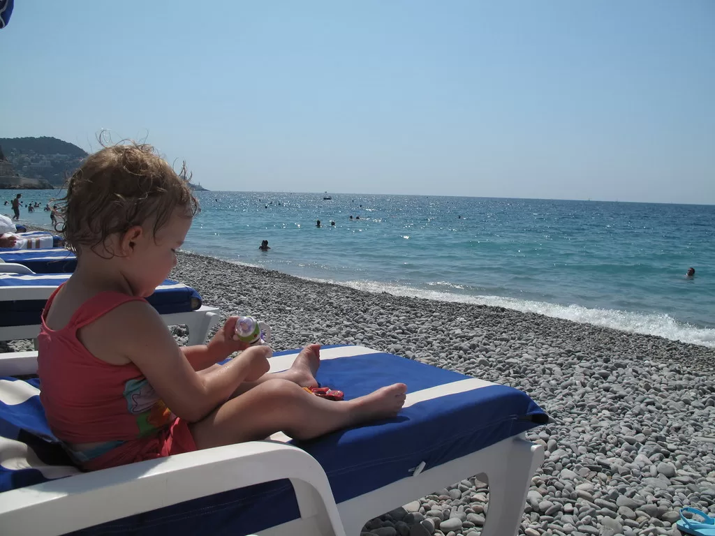 Little girl on beach in nice, france.