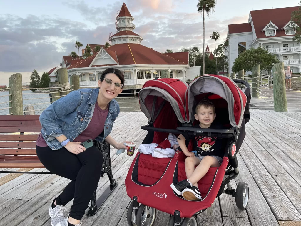 Kids in a stroller with their mom at grand floridian resort. 
