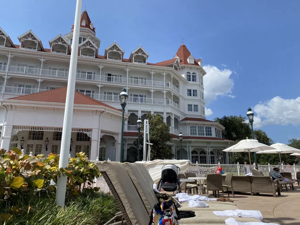 white victorian style hotel.  Grand Floridian with kids at disney world