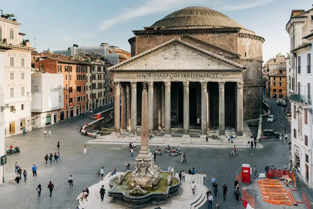 people walking near brown concrete building during daytime. Pantheon Rome