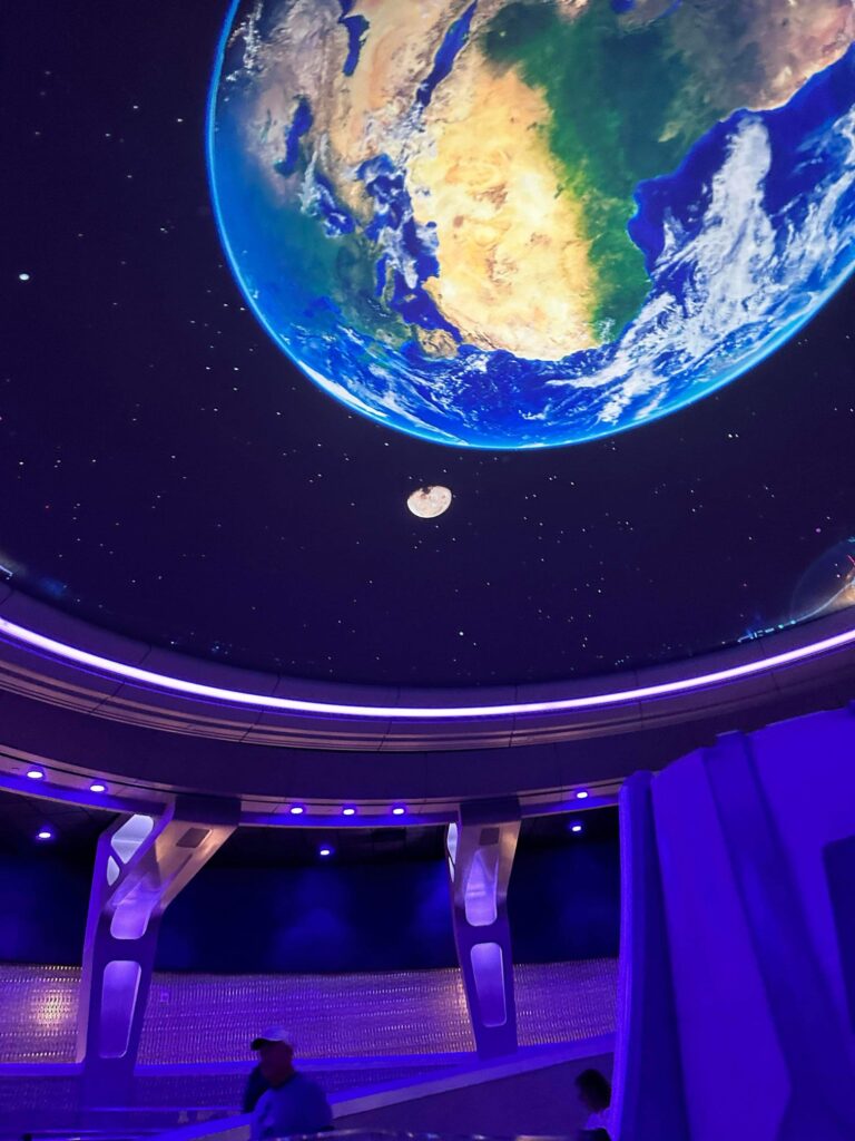 Mural of the earth pained on the ceiling at Disney's spaceship earth