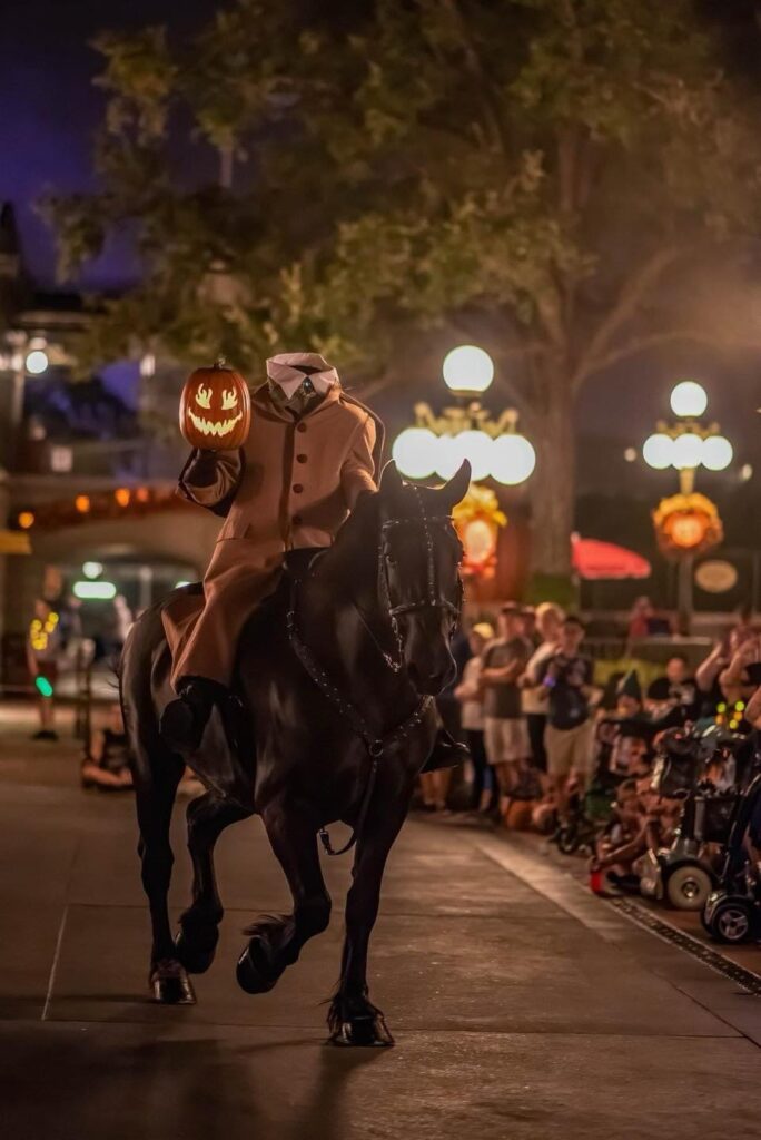 headless man riding a horse in the halloween party at disney world