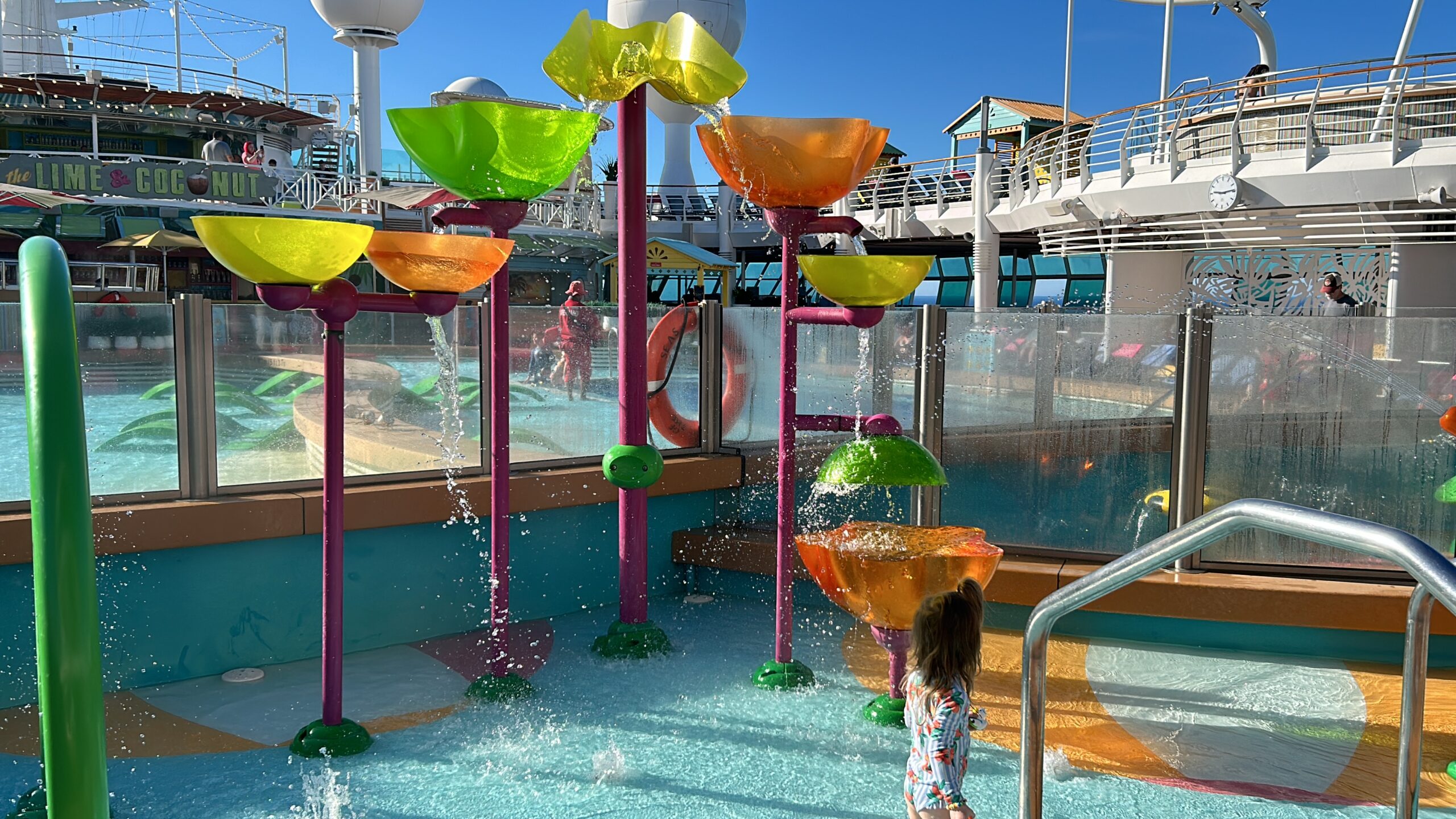 Large colorful water buckets at a children's at navigator of the seas splash pad